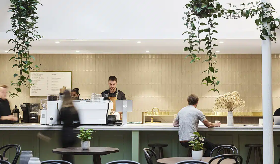 hub collins street cafe with people working at counter
