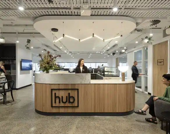 Welcome desk at Hub St Kilda Road with two people